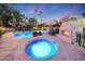 Luxury pool and spa with fire pit and lounge area at 6107 E Paradise Dr, Scottsdale, AZ 85254
