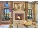 Elegant fireplace with ornate mantel in dining room at 6107 E Paradise Dr, Scottsdale, AZ 85254