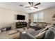Spacious living room featuring a sectional sofa and fireplace at 2440 E Saint Catherine Ave, Phoenix, AZ 85042