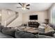 Spacious living room featuring a sectional sofa and fireplace at 2440 E Saint Catherine Ave, Phoenix, AZ 85042