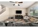 Spacious living room featuring a sectional sofa and fireplace at 2440 E Saint Catherine Ave, Phoenix, AZ 85042