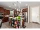 Island kitchen with stainless steel appliances and ample storage at 2440 E Saint Catherine Ave, Phoenix, AZ 85042