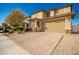 Two story home with tan exterior and two car garage at 2440 E Saint Catherine Ave, Phoenix, AZ 85042