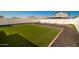 Artificial turf backyard with privacy fence at 2440 E Saint Catherine Ave, Phoenix, AZ 85042