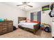 bedroom with a twin bed and dresser at 2440 E Saint Catherine Ave, Phoenix, AZ 85042
