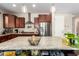 Kitchen island with granite countertop and storage at 2440 E Saint Catherine Ave, Phoenix, AZ 85042