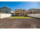 Home with turf backyard, covered patio, and gravel area at 2440 E Saint Catherine Ave, Phoenix, AZ 85042