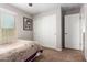 Bedroom with a full-size bed, large closet, and window at 2440 E Saint Catherine Ave, Phoenix, AZ 85042