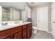 Double vanity bathroom with a shower and toilet at 2440 E Saint Catherine Ave, Phoenix, AZ 85042