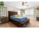 Spacious bedroom with a large bed, nightstands, and ceiling fan at 2440 E Saint Catherine Ave, Phoenix, AZ 85042