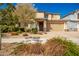 Two story home with tan exterior and two car garage at 2440 E Saint Catherine Ave, Phoenix, AZ 85042