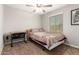 Bedroom with a single bed, desk, and ceiling fan at 2440 E Saint Catherine Ave, Phoenix, AZ 85042