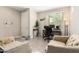 Bright entryway with seating area, work space, and neutral decor at 2440 E Saint Catherine Ave, Phoenix, AZ 85042