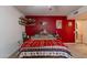 Bedroom with red walls and southwestern decor at 18031 N Buntline Dr, Sun City West, AZ 85375