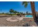 Enjoyable patio seating area with a table and chairs, overlooking the pool at 18031 N Buntline Dr, Sun City West, AZ 85375