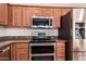 Stainless steel appliances and granite countertops in kitchen at 16039 W Heritage Dr, Sun City West, AZ 85375