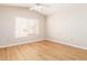 Bright bedroom with laminate flooring and a ceiling fan at 16039 W Heritage Dr, Sun City West, AZ 85375