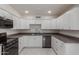Modern kitchen with white cabinets, stainless steel appliances and granite countertops at 8508 W Clarendon W Ave, Phoenix, AZ 85037
