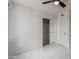 Bedroom with tile floors, ceiling fan, and double door closet at 8508 W Clarendon W Ave, Phoenix, AZ 85037