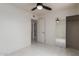 Bedroom with tile floors, mirrored closet doors, and access to bathroom at 8508 W Clarendon W Ave, Phoenix, AZ 85037