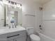 Updated bathroom with white subway tile, bathtub, and modern vanity at 8508 W Clarendon W Ave, Phoenix, AZ 85037