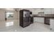 Modern kitchen with white cabinets, stainless steel appliances, and tile floors at 8508 W Clarendon W Ave, Phoenix, AZ 85037
