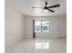 Living room featuring tile floors, large window, and ceiling fan at 8508 W Clarendon W Ave, Phoenix, AZ 85037