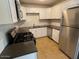 Modern kitchen featuring stainless steel appliances and dark countertops at 3111 N 34Th St, Phoenix, AZ 85018