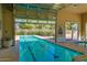 Indoor lap pool with a large sliding door opening to the outdoors at 15016 W Monterey Way, Goodyear, AZ 85395