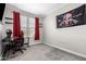 Bright bedroom with window, desk, and chair at 17657 W Buckhorn Trl, Surprise, AZ 85387