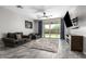 Spacious living room with sliding glass doors leading to the backyard at 17657 W Buckhorn Trl, Surprise, AZ 85387