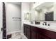 Clean bathroom with double vanity and shower at 17657 W Buckhorn Trl, Surprise, AZ 85387