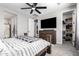 Bright bedroom with walk-in closet and built-in shelves at 17657 W Buckhorn Trl, Surprise, AZ 85387