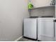 Laundry room with washer, dryer, and shelving at 17657 W Buckhorn Trl, Surprise, AZ 85387