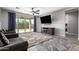 Bright living room with tile floors,sliding glass doors, and a view of the backyard at 17657 W Buckhorn Trl, Surprise, AZ 85387