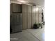 Garage with built-in cabinets and refrigerator at 21487 E Arroyo Verde Dr, Queen Creek, AZ 85142