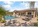 Inviting backyard oasis with a refreshing pool and comfortable lounge chairs at 21487 E Arroyo Verde Dr, Queen Creek, AZ 85142