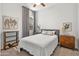 Bright bedroom with a comfortable bed and mid-century modern furniture at 21487 E Arroyo Verde Dr, Queen Creek, AZ 85142