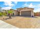 Single story home with landscaped front yard and two-car garage at 21487 E Arroyo Verde Dr, Queen Creek, AZ 85142