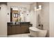 Modern bathroom boasts a freestanding tub and double vanity with marble countertops at 2136 E Paradise Ln, Phoenix, AZ 85022