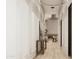 Elegant hallway with hardwood floors and modern lighting fixtures at 2136 E Paradise Ln, Phoenix, AZ 85022