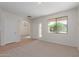 Bright and airy living room with entryway and large window at 40752 W Robbins Dr, Maricopa, AZ 85138