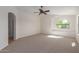 Bright and airy bedroom with ceiling fan and large window at 40752 W Robbins Dr, Maricopa, AZ 85138