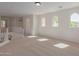 Spacious loft area with natural light and carpet flooring at 40752 W Robbins Dr, Maricopa, AZ 85138