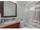 Clean bathroom with tub shower, granite vanity, and updated fixtures at 40752 W Robbins Dr, Maricopa, AZ 85138