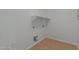 Laundry room with built-in shelving and tile flooring at 40752 W Robbins Dr, Maricopa, AZ 85138
