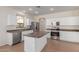Modern kitchen featuring stainless steel appliances and a large island at 40752 W Robbins Dr, Maricopa, AZ 85138