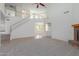 Two-story living room with staircase and views to other rooms at 40752 W Robbins Dr, Maricopa, AZ 85138