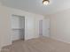 Spacious bedroom with double door closet and neutral decor at 40752 W Robbins Dr, Maricopa, AZ 85138