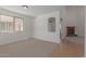 Spacious living room with fireplace and high ceilings at 40752 W Robbins Dr, Maricopa, AZ 85138